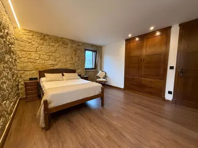 a bathroom with a sink and a mirror and towels at Casa con barbacoa · Casa Amelia by Easy Life Rent in Valga