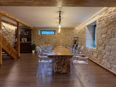 a stone building with a yard with green grass at Casa con barbacoa · Casa Amelia by Easy Life Rent in Valga