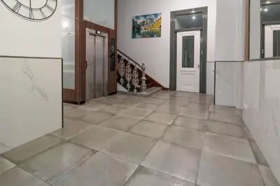 a hallway with a tile floor and a staircase at Apartamento Paseo Malécon Planta 3 in Monforte de Lemos