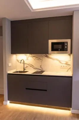 a kitchen with a sink and a microwave at Caño in Pincelo