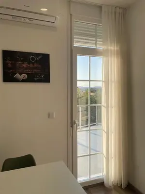 a white room with a door and a window at Apartamento Paseo Malecón Planta 2 in Monforte de Lemos