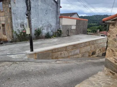 an old stone house with a tile roof at A Casa de Salvador - retiro rural con alma gallega in Vedra