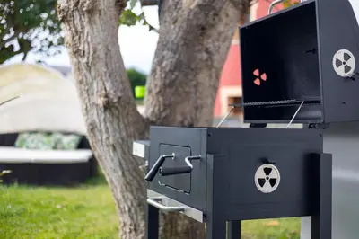 a black box with a tv in front of a tree at Villa Las Catedrales - Frente a la playa - Amplio jardín - Piscina in Barreiros