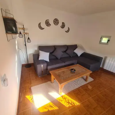 a living room with a couch and a coffee table at Villa Mallorquina tu zona para desconectar