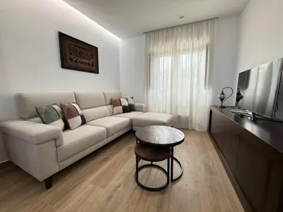 a living room with a couch and a table at Casa Aldea de Piñeiro, Turismo Rural Padrón by URent in Padrón