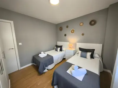 a hotel room with two beds at Apart Martínez Rosalía in Padrón
