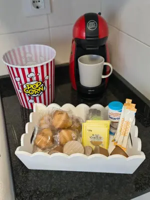 a tray of food on a counter with a cup of coffee at Apart Martínez Rosalía in Padrón