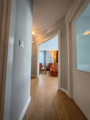 an open hallway with a living room in a house at Apart Martínez Rosalía in Padrón