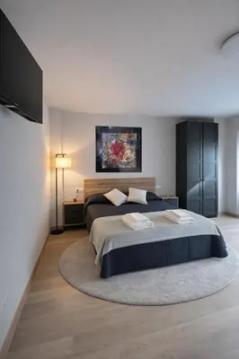 a bedroom with a bed with two towels on it at Apartamento Alba 1.1 in Lugo