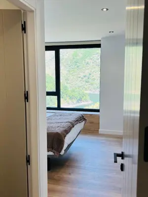 a room with a bed and a large window at Chulavista House by Kev in Parada del Sil
