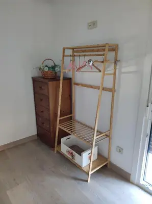 a ladder next to a dresser in a room at Cesarina Urban House in Chantada
