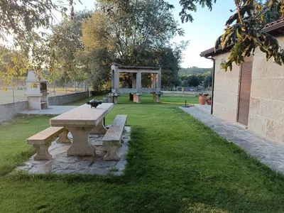 a picnic table with a cat sitting on top of it at Vilaboa Paradise in Villanueva