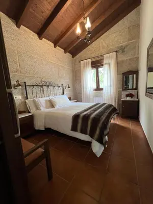 a bedroom with a large bed in a room at Vilaboa Paradise in Villanueva