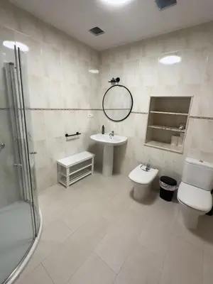 a bathroom with a sink and a toilet and a shower at Go Compostela Apartamento 4 pax in Sarria