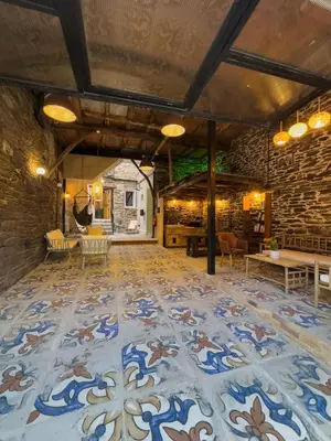 a large room with a blue and white tile floor at Go Compostela Apartamento 4 pax in Sarria