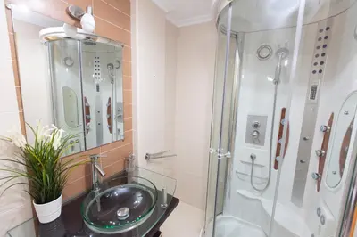 a bathroom with a sink and a shower at Apartagal-Océano V Barreiros in Barreiros