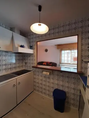 a small kitchen with a sink and a window at Apartamento Playa de Ber Ber-Mar in Perbes