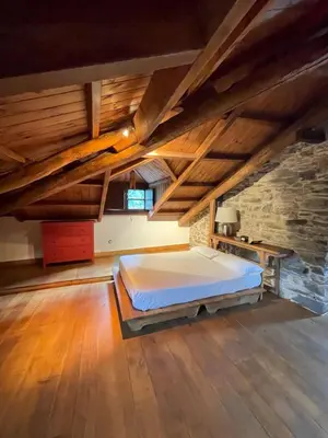 a bedroom with a bed in an attic at La Brisa Del Bierzo in Toral de Merayo