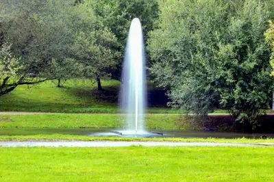 a fountain in the middle of a park at VIVIENDA OLGA, piso tranquilo con parking a 10 min de Santiago in Sigüeiro