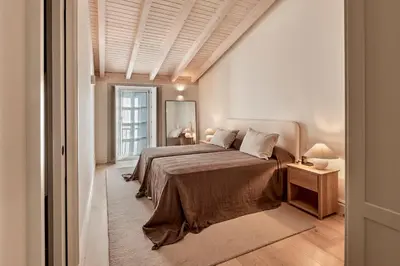 a bedroom with two beds and a window at Casa Conde in Furelos