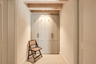 a room with a chair and a closet at Casa Conde in Furelos