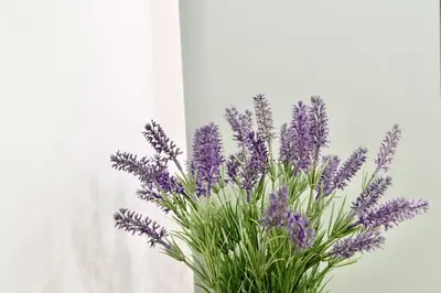 a bouquet of purple flowers in a vase at Train Station by Lugo Collection in Lugo