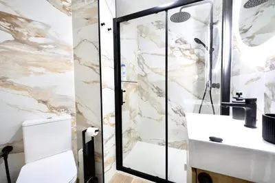 a bathroom with a sink and a shower at Train Station by Lugo Collection in Lugo