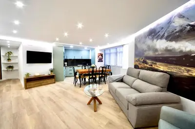a living room with a couch and a table at Train Station by Lugo Collection in Lugo