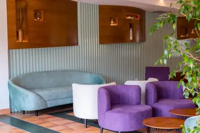 a waiting room with two chairs and a couch at Hotel O Cabazo in Ribadeo