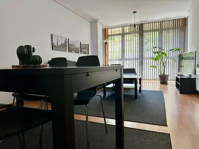 a living room with a table and chairs at A Gandarela in Ribadavia