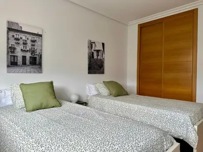 two beds sitting next to each other in a bedroom at A Gandarela in Ribadavia
