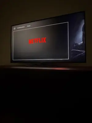 a television with the words netflix on the screen at Dúplex Carballiño in Carballino