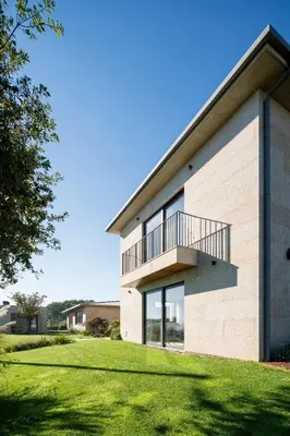 a building with a balcony on the side of it at Relax in Santiago de Compostela in Vedra