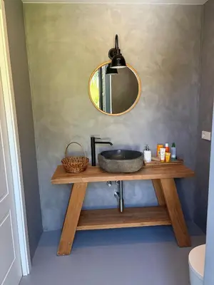 a bathroom with a sink and a mirror on a table at Relax in Santiago de Compostela in Vedra