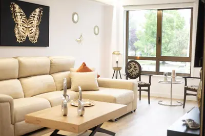 a living room with a couch and a table at GemAn1 in Monforte de Lemos