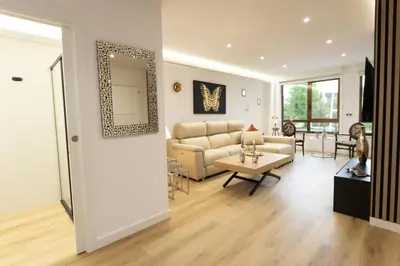 a living room with a couch and a table at GemAn1 in Monforte de Lemos