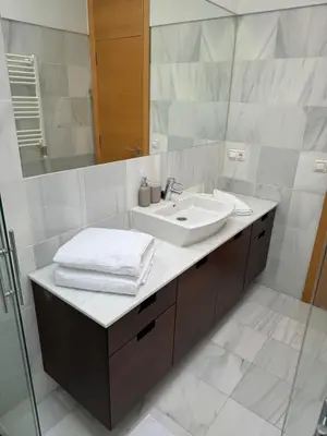 a bathroom with a sink and a mirror at Loft Experience in Amés