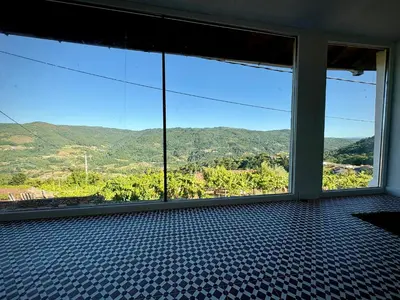 a room with a large window with a view at Wine Lodge Ribeira Sacra in Carracedo