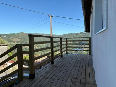 a balcony with a view of the mountains at Wine Lodge Ribeira Sacra in Carracedo