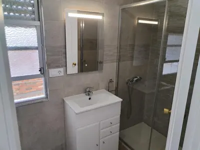 a bathroom with a sink and a shower at Apartamento en Carballiño in Carballino