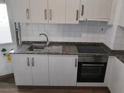 a kitchen with a sink and a counter top at Apartamento en Carballiño in Carballino