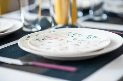 a plate with sprinkles on it sitting on a table at Aida's Apartments in Puentes de García Rodríguez