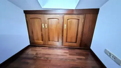 a room with wooden cabinets and wood floors at Garcia Prieto Vivienda in Santiago de Compostela