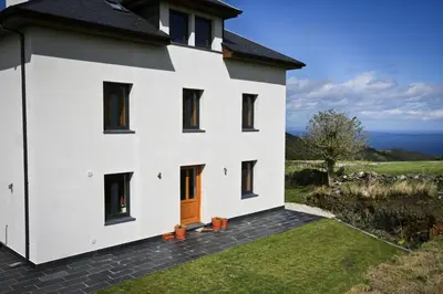 a white house with a view of the ocean at Casa Xabú in El Vallin