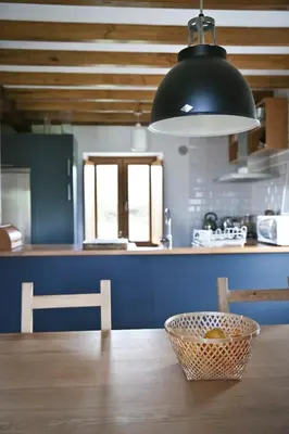 a kitchen with a table with a basket on it at Casa Xabú in El Vallin