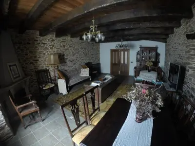 a living room with a couch and a table at Casa Grande de Anllo in Sistallo