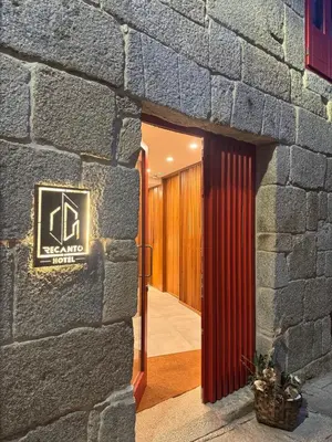 a bedroom with a bed and a bath tub at Hotel Recanto do Avia in Ribadavia