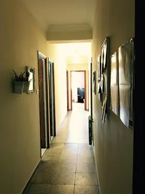 a hallway with a tile floor in a room at Apartment Lugo Rooms in Lugo