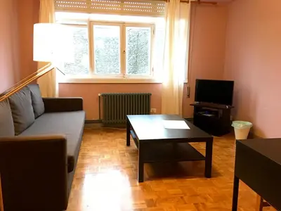 a living room with a couch and a table at Apartment Lugo Rooms in Lugo