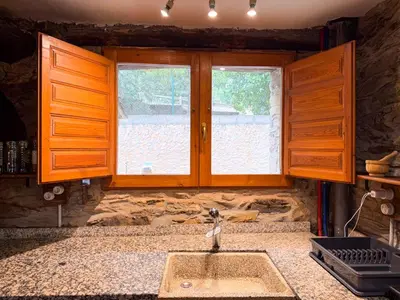 a kitchen with a sink and a window at La Casa del Monte in Ocero
